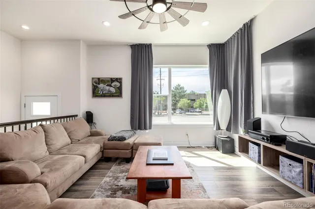 a living room with furniture and a window