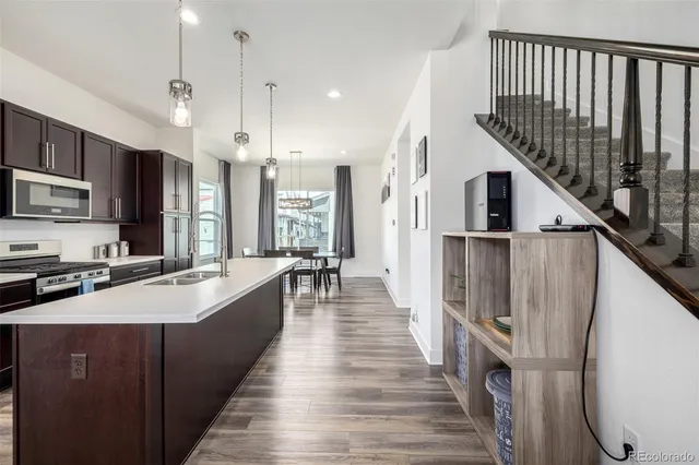 a large kitchen with stainless steel appliances granite countertop a lot of counter space