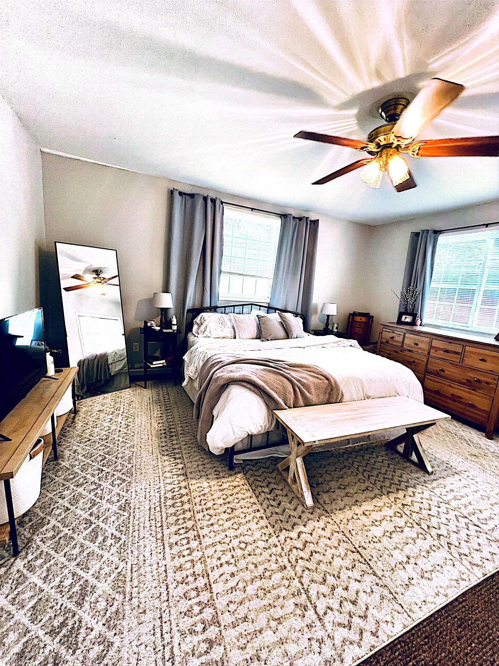 521 North Walnut Street Byron, IL 61010 - Photo 5 of 9 a bedroom with a bed lamp and a large window