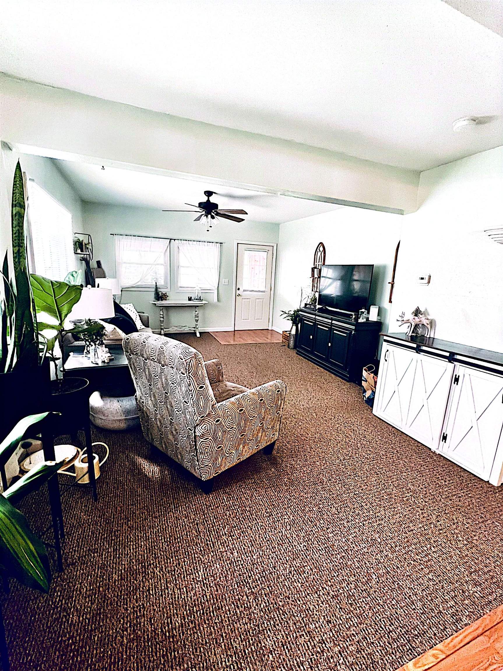 521 North Walnut Street Byron, IL 61010 - Photo 6 of 9 a bedroom with furniture and a window