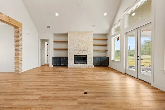 a view of a kitchen with a sink and a large window