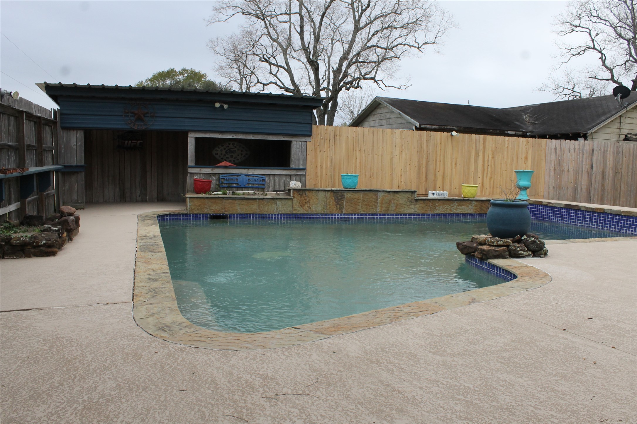 1111 Spur 529 Rosenberg, TX 77471 - Photo 11 of 14 Another view of the pool, decking, covered outdoor area and more.