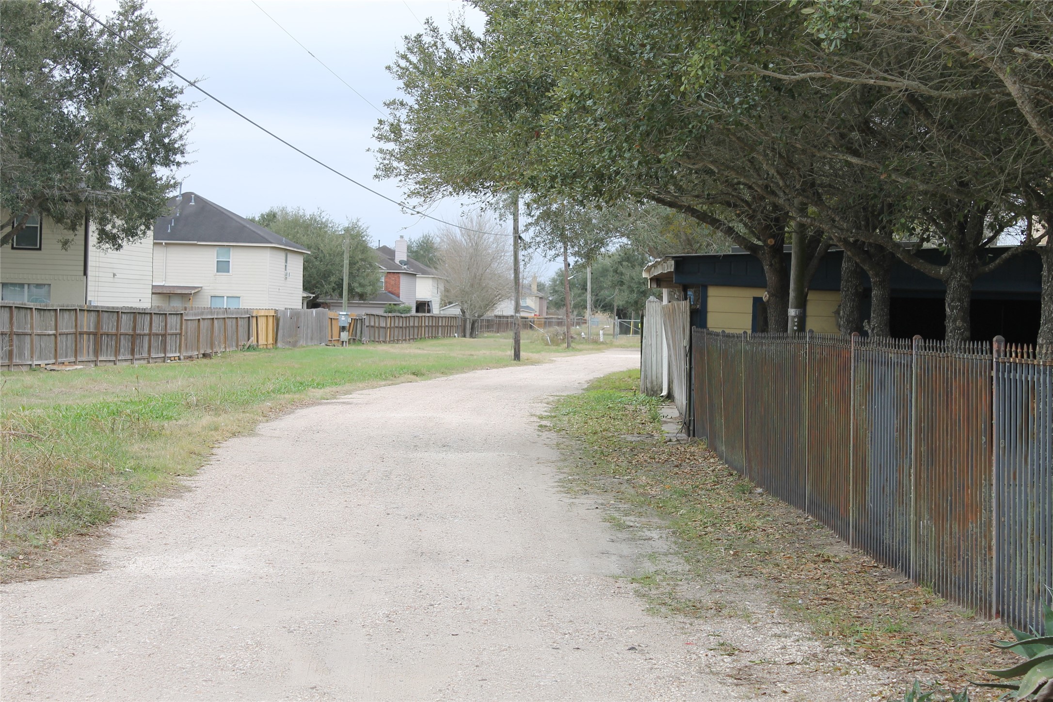 1111 Spur 529 Rosenberg, TX 77471 - Photo 9 of 14 Access road leading to 1117 Spur 529 which is the rear lot being sold with 1111 Spur 529.