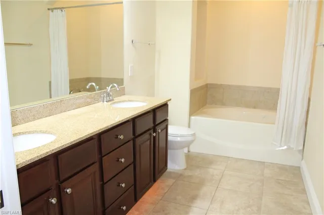a bathroom with a sink a toilet and bathtub