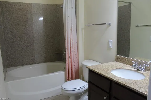 a bathroom with a sink a toilet and a bathtub