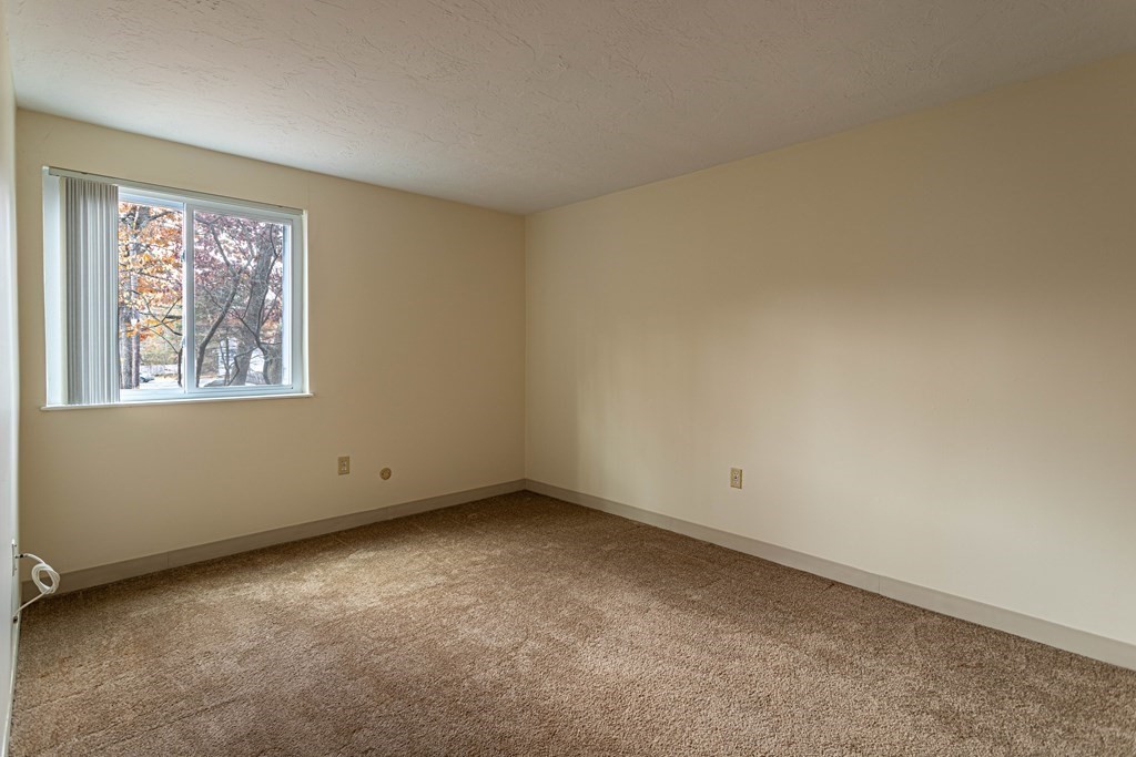 10 Mill Street, Unit X Maynard, MA 01754 - Photo 12 of 16 a view of an empty room with a window