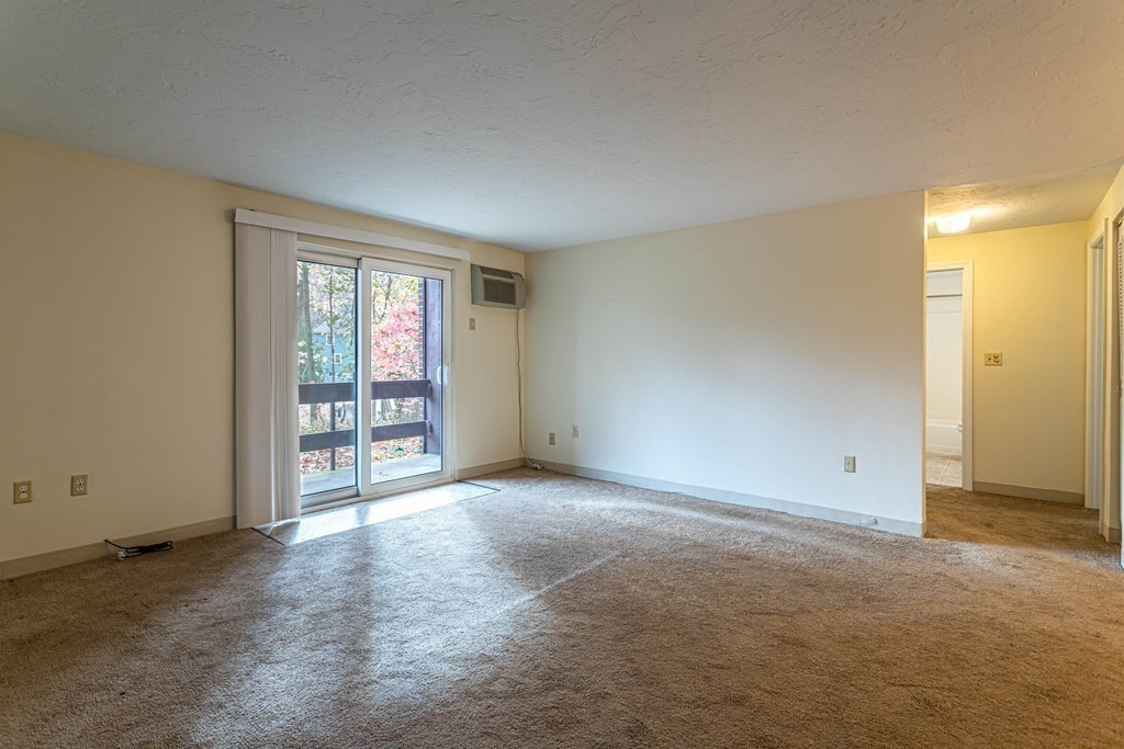 10 Mill Street, Unit X Maynard, MA 01754 - Photo 2 of 16 an empty room with windows