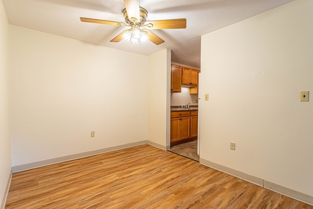 10 Mill Street, Unit X Maynard, MA 01754 - Photo 5 of 16 a view of empty room with wooden floor