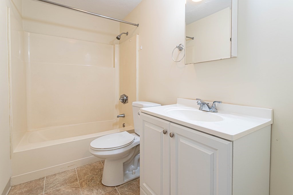 10 Mill Street, Unit X Maynard, MA 01754 - Photo 8 of 16 a bathroom with a sink toilet and shower