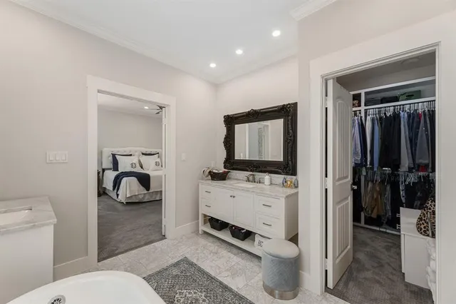 a en suite bathroom with a toilet a sink and a mirror