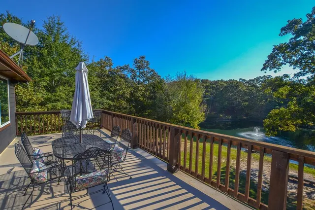 a view of a balcony with chairs