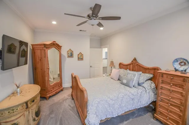 a bedroom with bed and a dresser