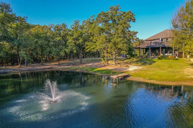 a view of a lake with a house in the background