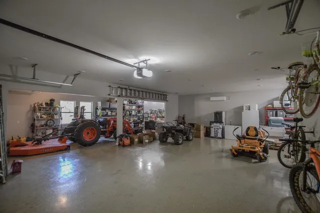 a view of a garage with a bike and car