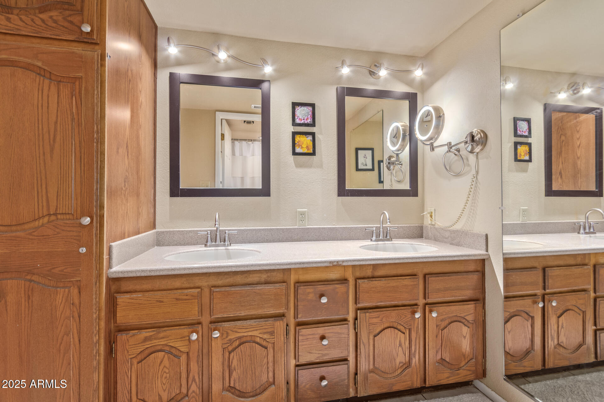 4303 East Cactus Road, Unit 202 Phoenix, AZ 85032 - Photo 13 of 34 a bathroom with a double vanity sink mirror and