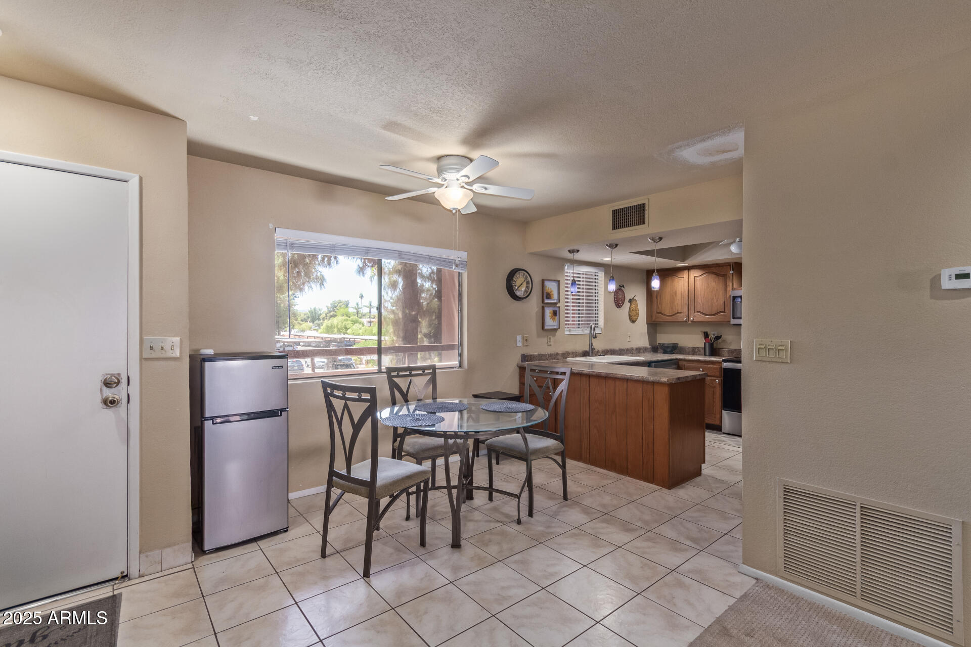 4303 East Cactus Road, Unit 202 Phoenix, AZ 85032 - Photo 5 of 34 a dining room with furniture and window