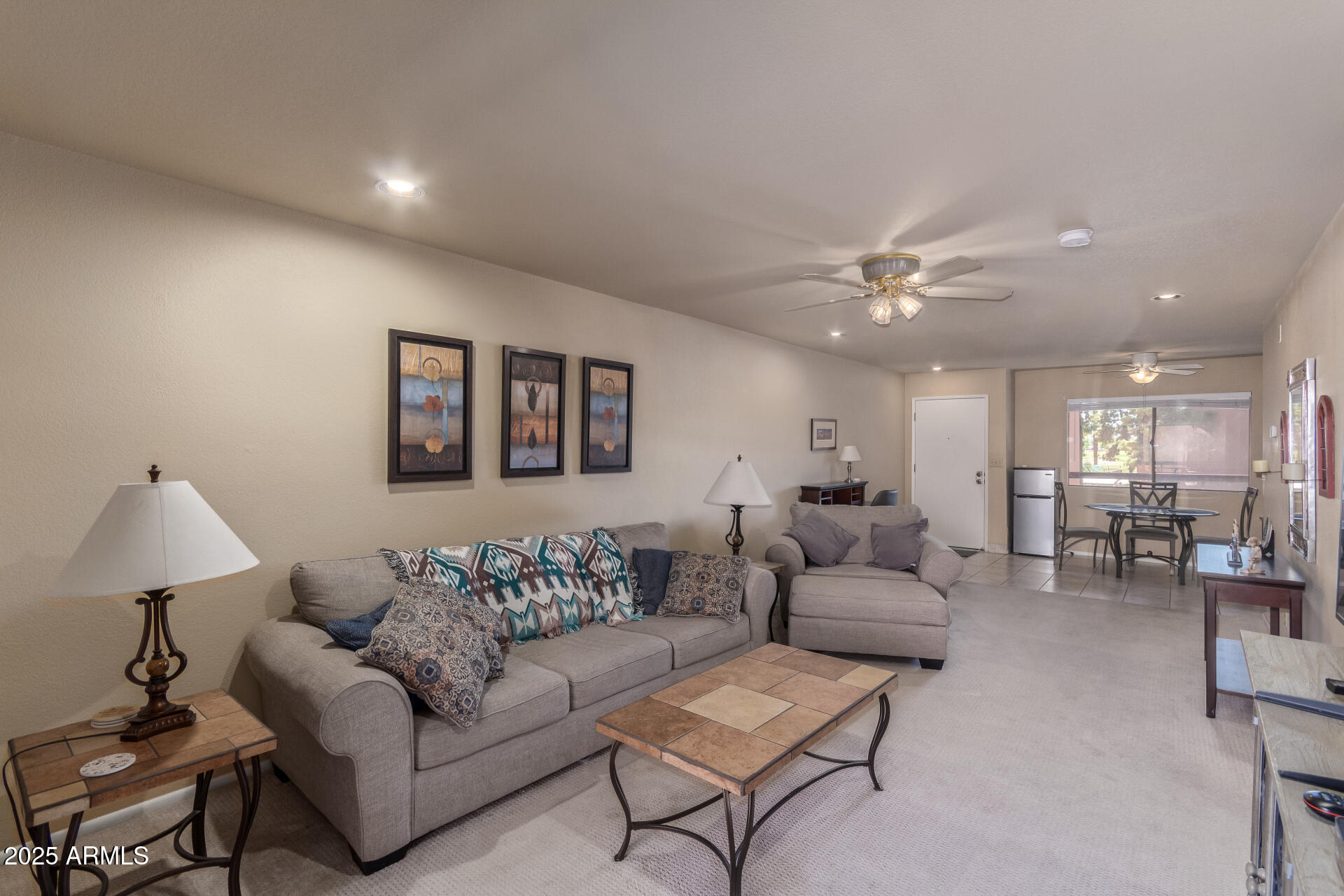 4303 East Cactus Road, Unit 202 Phoenix, AZ 85032 - Photo 7 of 34 a living room with furniture and a lamp