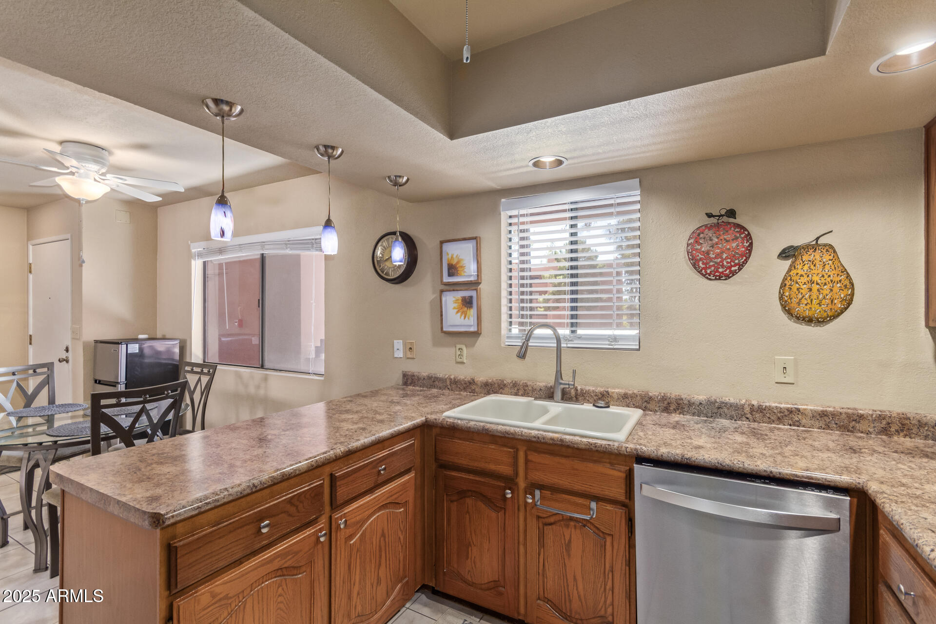 4303 East Cactus Road, Unit 202 Phoenix, AZ 85032 - Photo 10 of 34 a bathroom with a granite countertop sink a large mirror and a window
