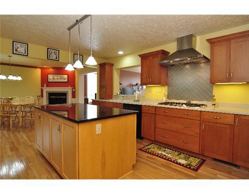 301 Pinkerton Road Wexford, PA 15090 - Photo 2 of 18 Kitchen. Center island with granite counter top. Gas cooktop w.Thermodore hood, 2 garbage disposals, microwave oven, and abundant cabinet space!