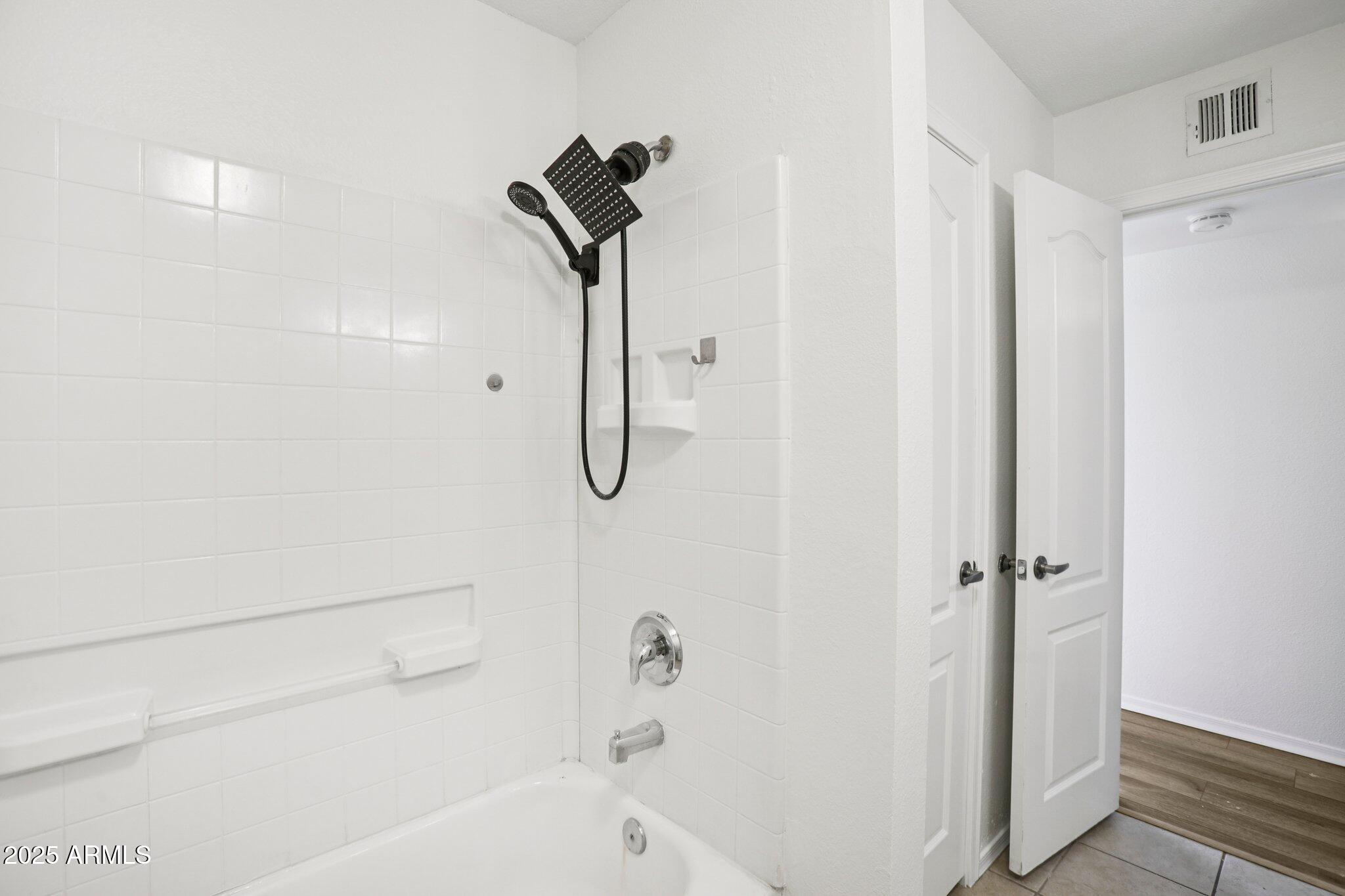 303 North Miller Road, Unit 1001 Scottsdale, AZ 85257 - Photo 12 of 20 a bathroom with a shower