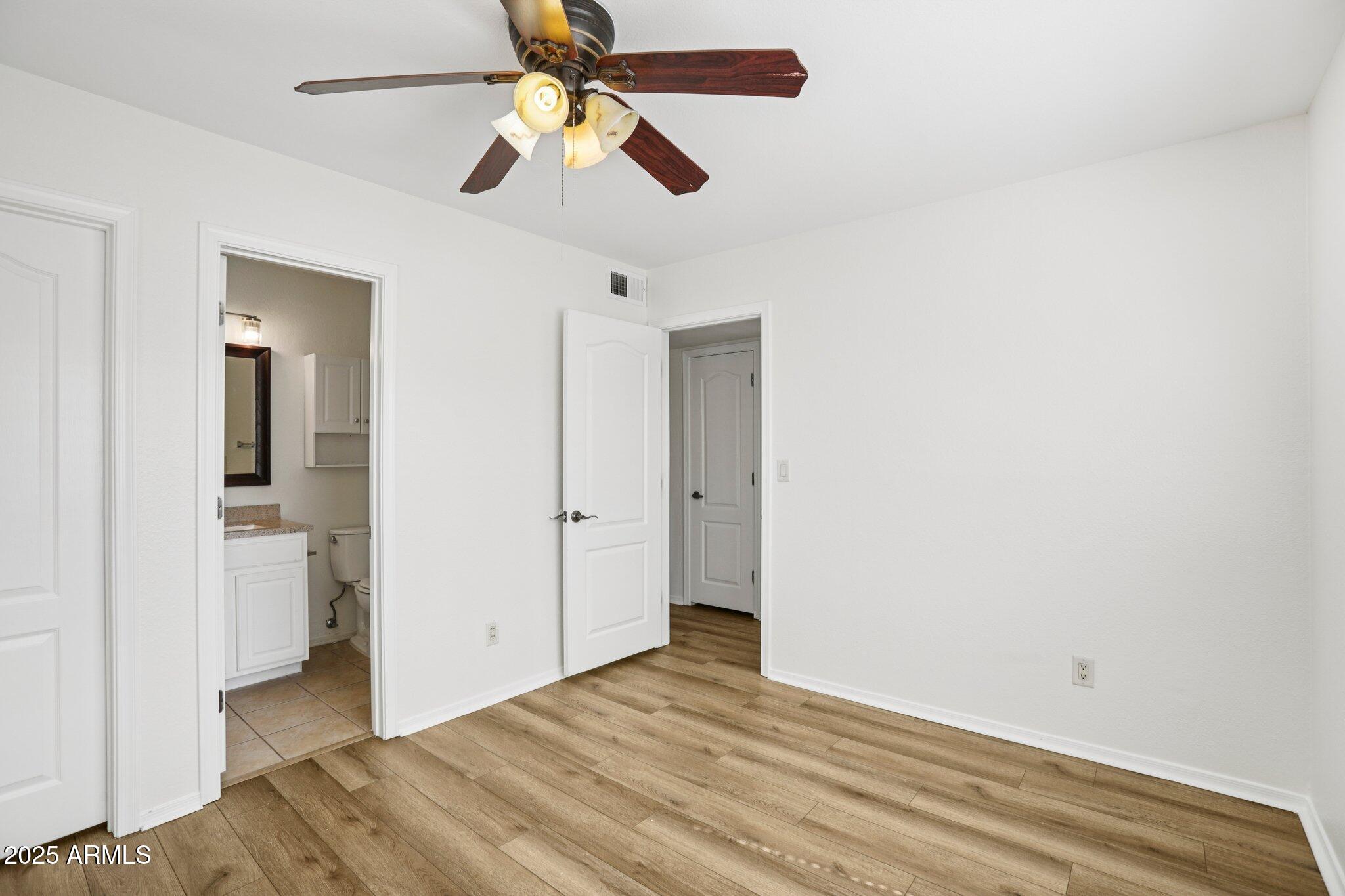 303 North Miller Road, Unit 1001 Scottsdale, AZ 85257 - Photo 18 of 20 wooden floor in an empty room