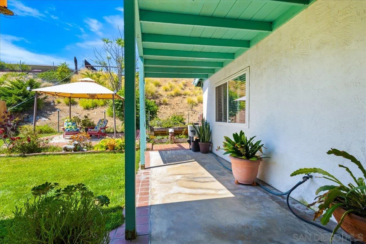 10738 2nd Street Santee, CA 92071 - Photo 35 of 52 a view of a patio with table and chairs potted plants