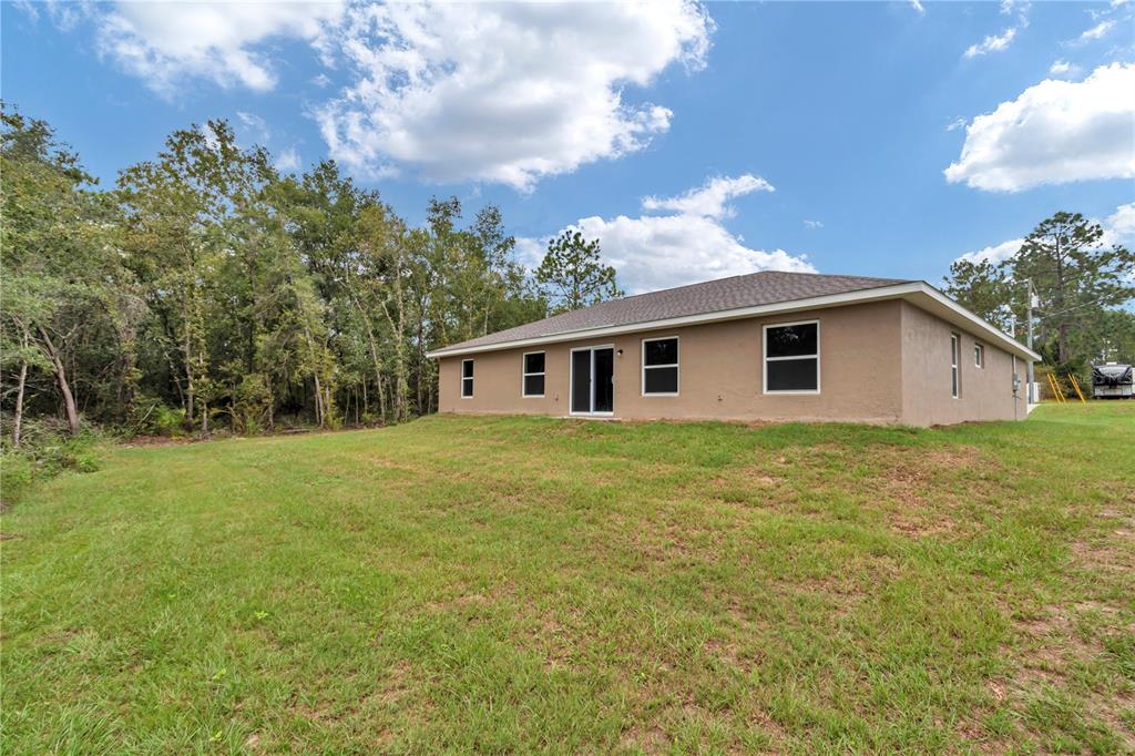 8040 Southwest 131st Lane Ocala, FL 34473 - Photo 9 of 39 a view of a house with backyard and garden