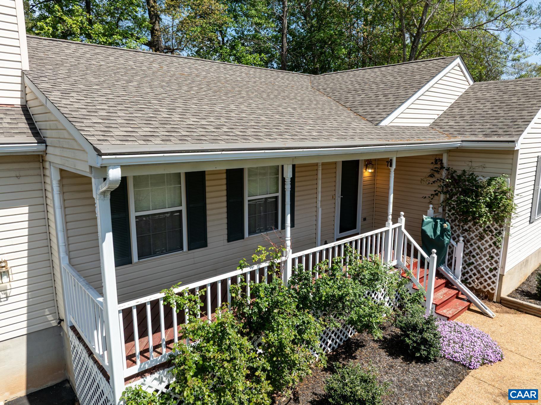 134 William Road Ruckersville, VA 22968 - Photo 3 of 23 a front view of a house with a garden