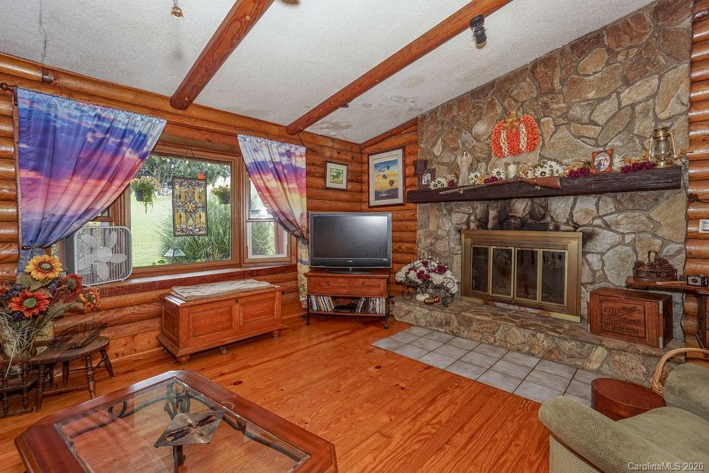 1471 J J Rhyne Reep Road Vale, NC 28168 - Photo 14 of 43 a living room with furniture a fireplace and a flat screen tv
