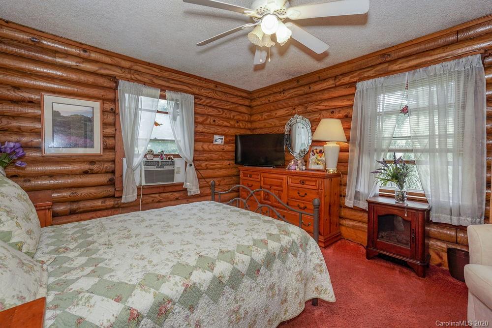 1471 J J Rhyne Reep Road Vale, NC 28168 - Photo 22 of 43 a bed room with a bed and a chandelier