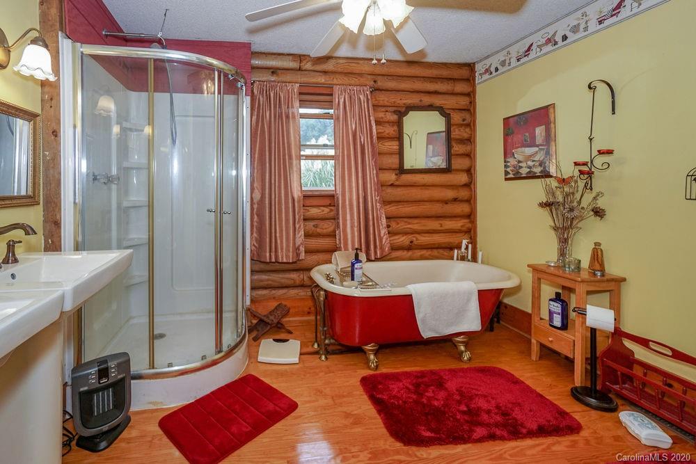 1471 J J Rhyne Reep Road Vale, NC 28168 - Photo 23 of 43 a bedroom with a bed and a chandelier