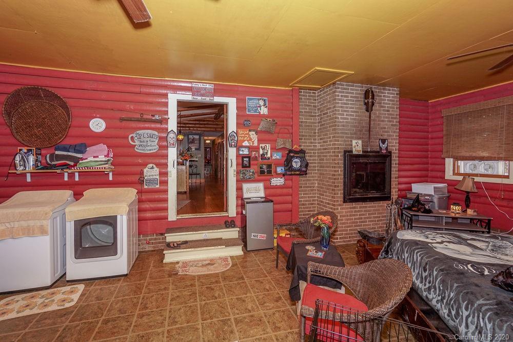 1471 J J Rhyne Reep Road Vale, NC 28168 - Photo 25 of 43 a living room with furniture a flat screen tv and a fireplace