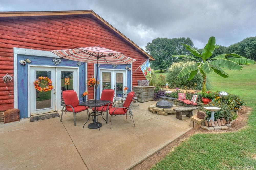 1471 J J Rhyne Reep Road Vale, NC 28168 - Photo 26 of 43 a view of a house with backyard sitting area and garden