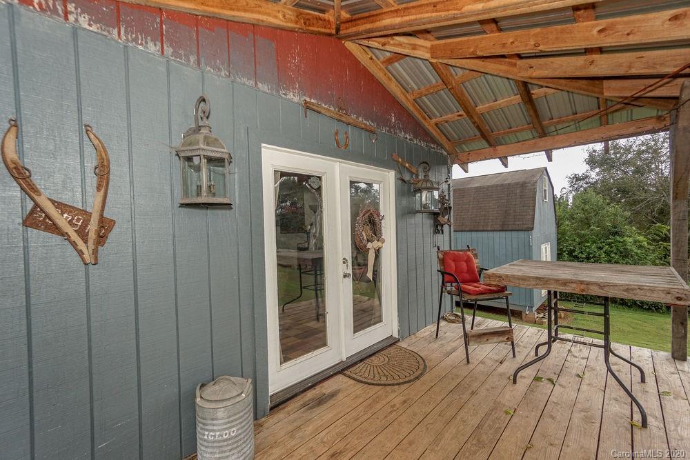 1471 J J Rhyne Reep Road Vale, NC 28168 - Photo 29 of 43 a patio with glass top table and chairs