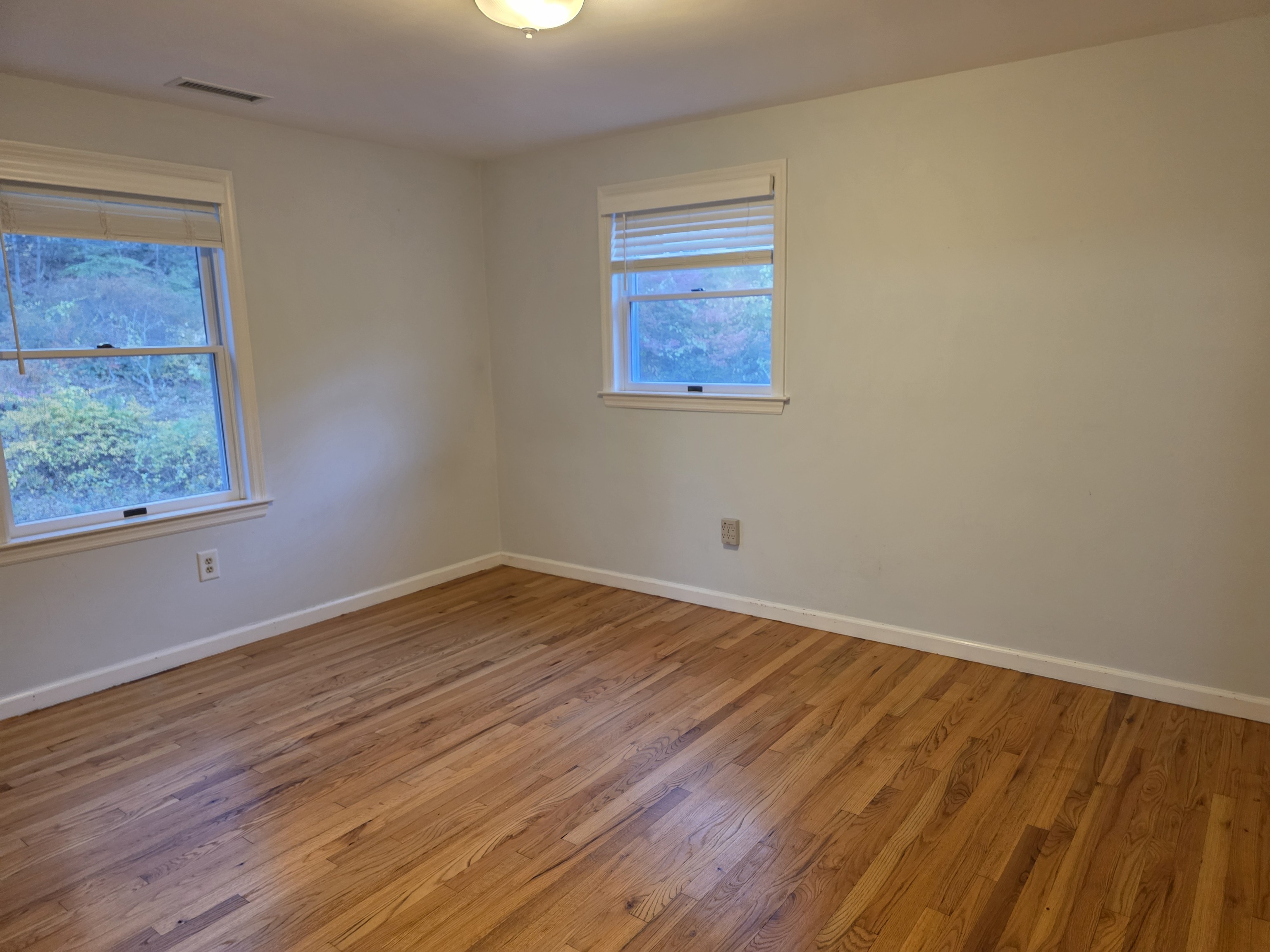 4 Stone Dam Road Bethel, CT 06801 - Photo 11 of 13 a view of an empty room with wooden floor and a window