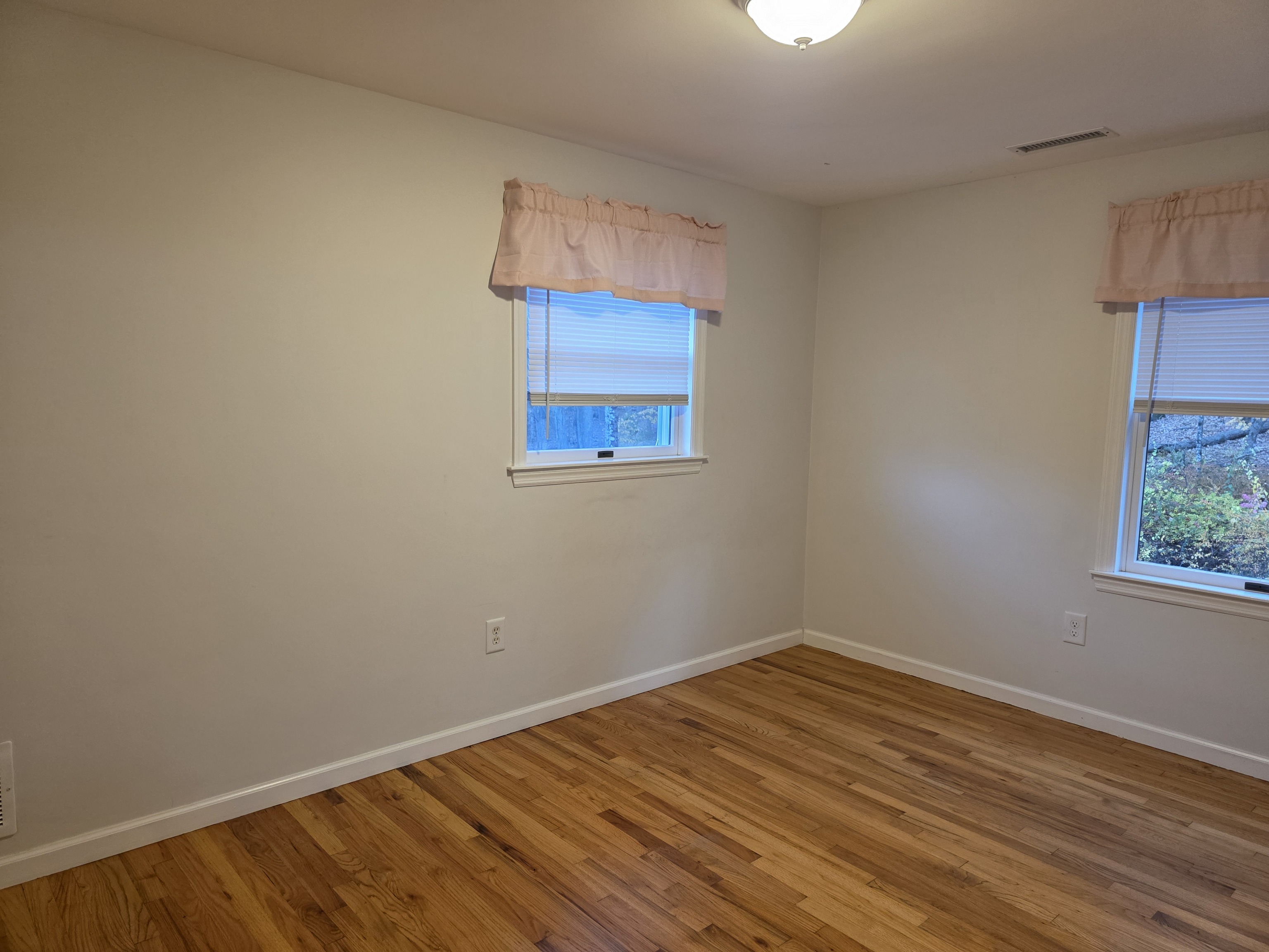 4 Stone Dam Road Bethel, CT 06801 - Photo 12 of 13 a view of an empty room with wooden floor and a window