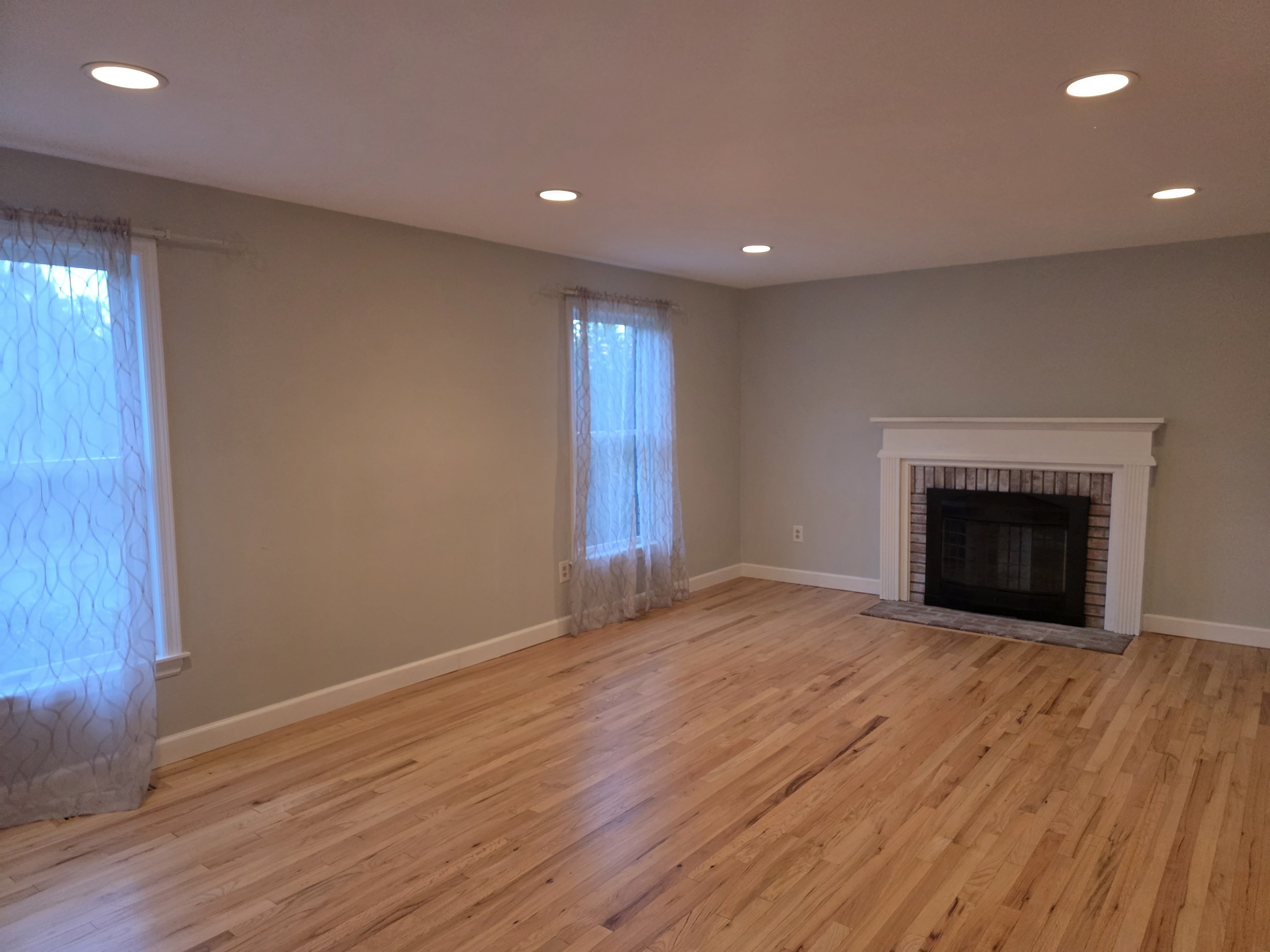 4 Stone Dam Road Bethel, CT 06801 - Photo 8 of 13 a view of empty room with wooden floor and fireplace