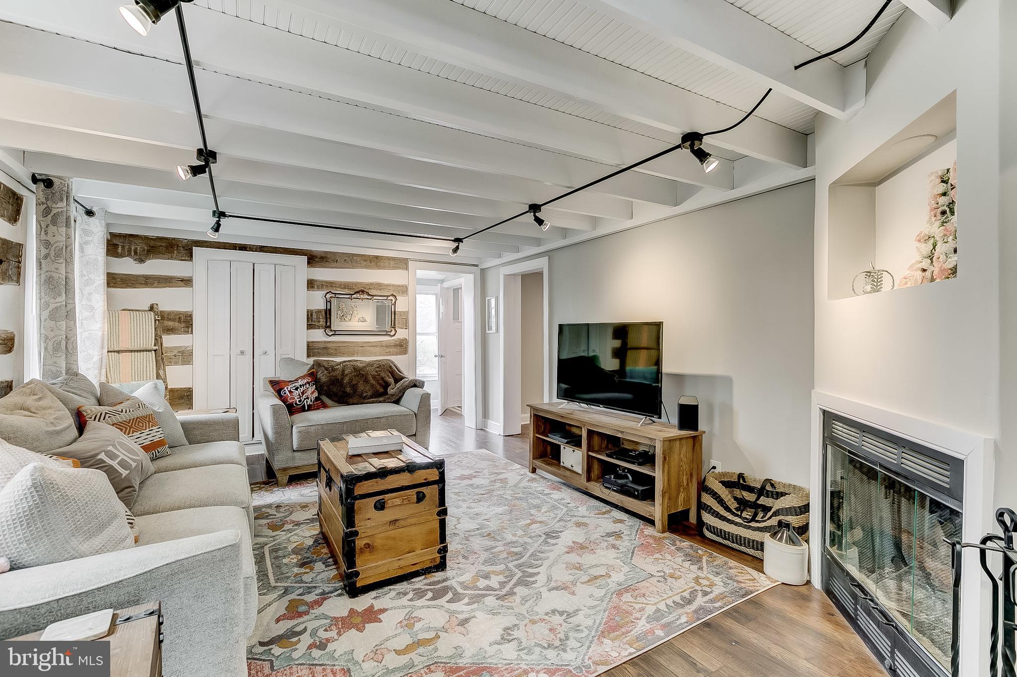 2812 Cape Horn Road Westminster, MD 21157 - Photo 14 of 40 a living room with furniture and a flat screen tv