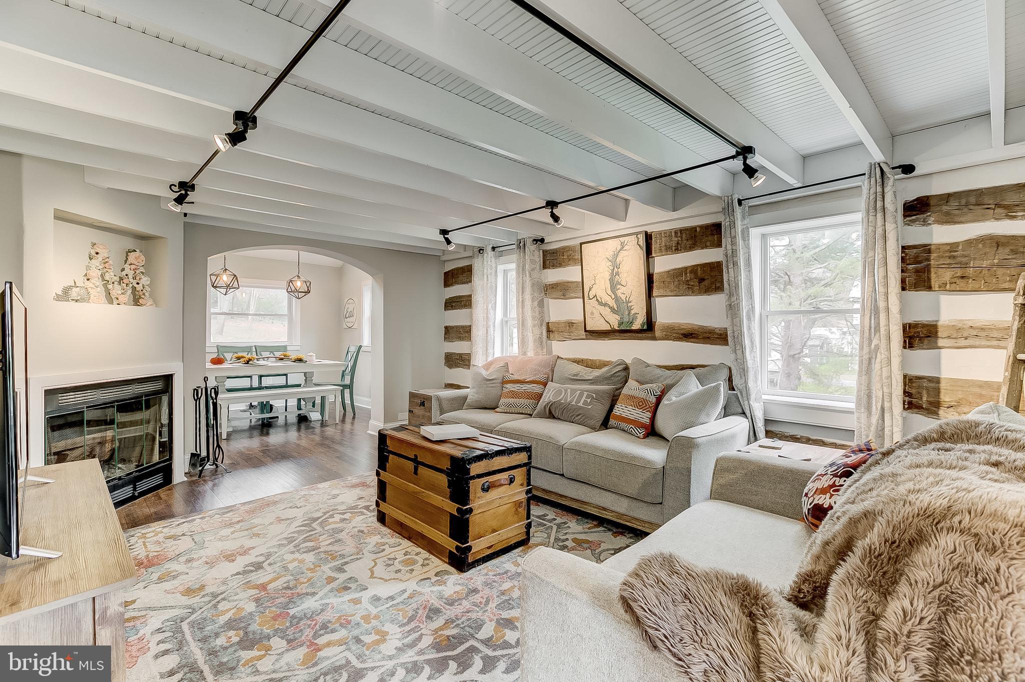 2812 Cape Horn Road Westminster, MD 21157 - Photo 16 of 40 a living room with furniture a large window and a fireplace