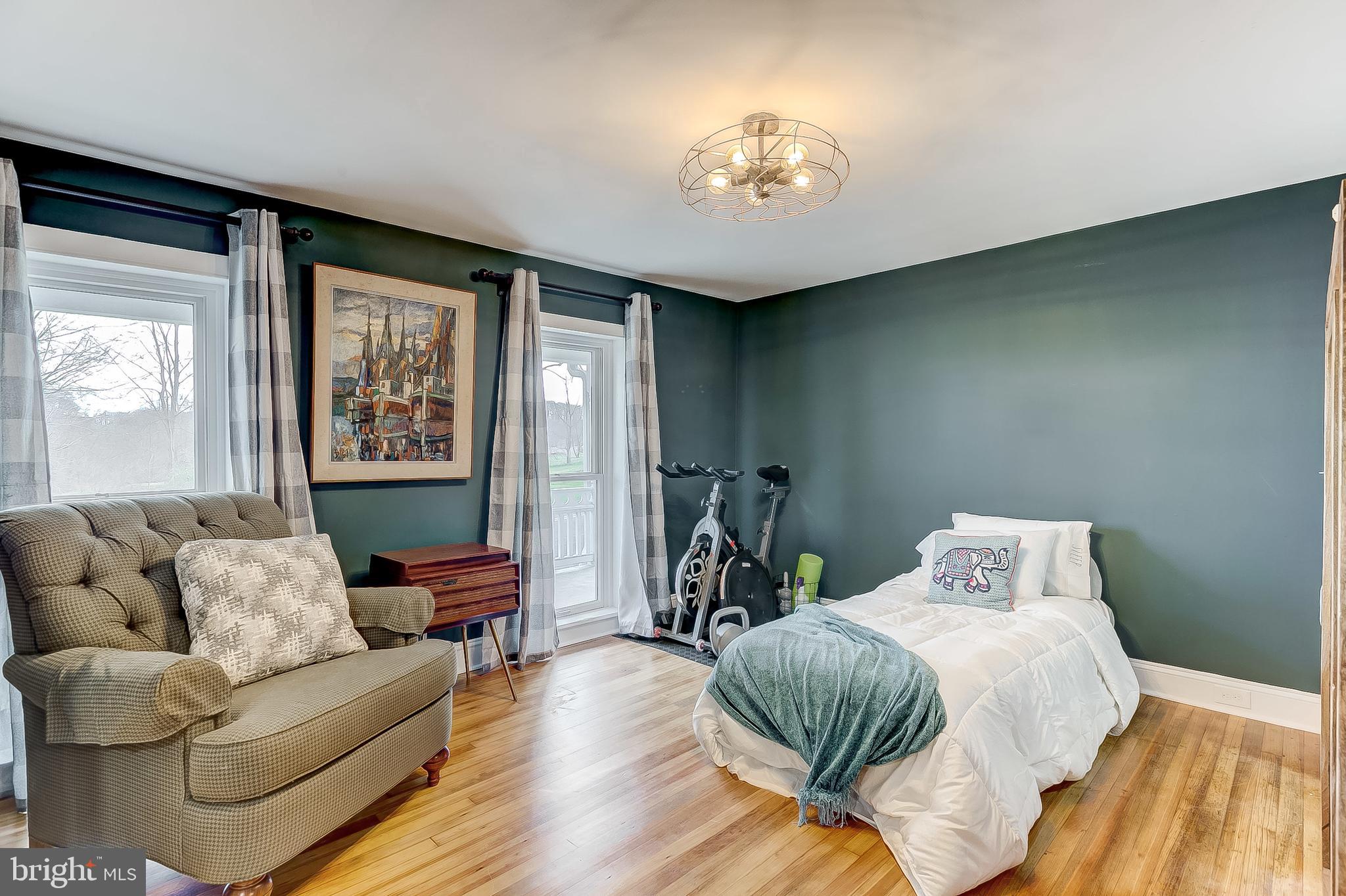 2812 Cape Horn Road Westminster, MD 21157 - Photo 19 of 40 a spacious bedroom with a bed and wooden floor