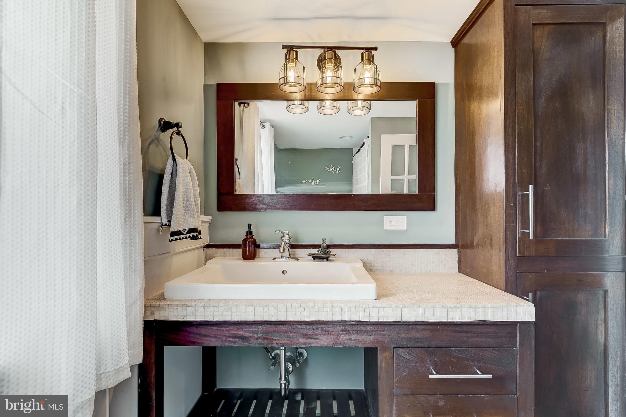 2812 Cape Horn Road Westminster, MD 21157 - Photo 26 of 40 a bathroom with a sink and a mirror