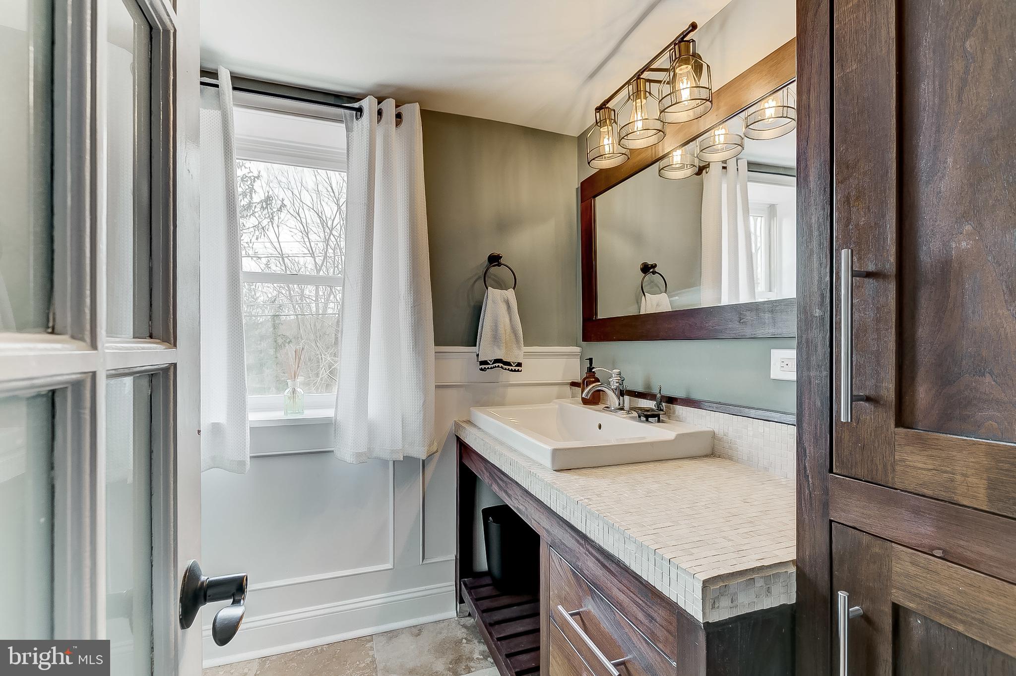 2812 Cape Horn Road Westminster, MD 21157 - Photo 27 of 40 a bathroom with a sink vanity and a mirror