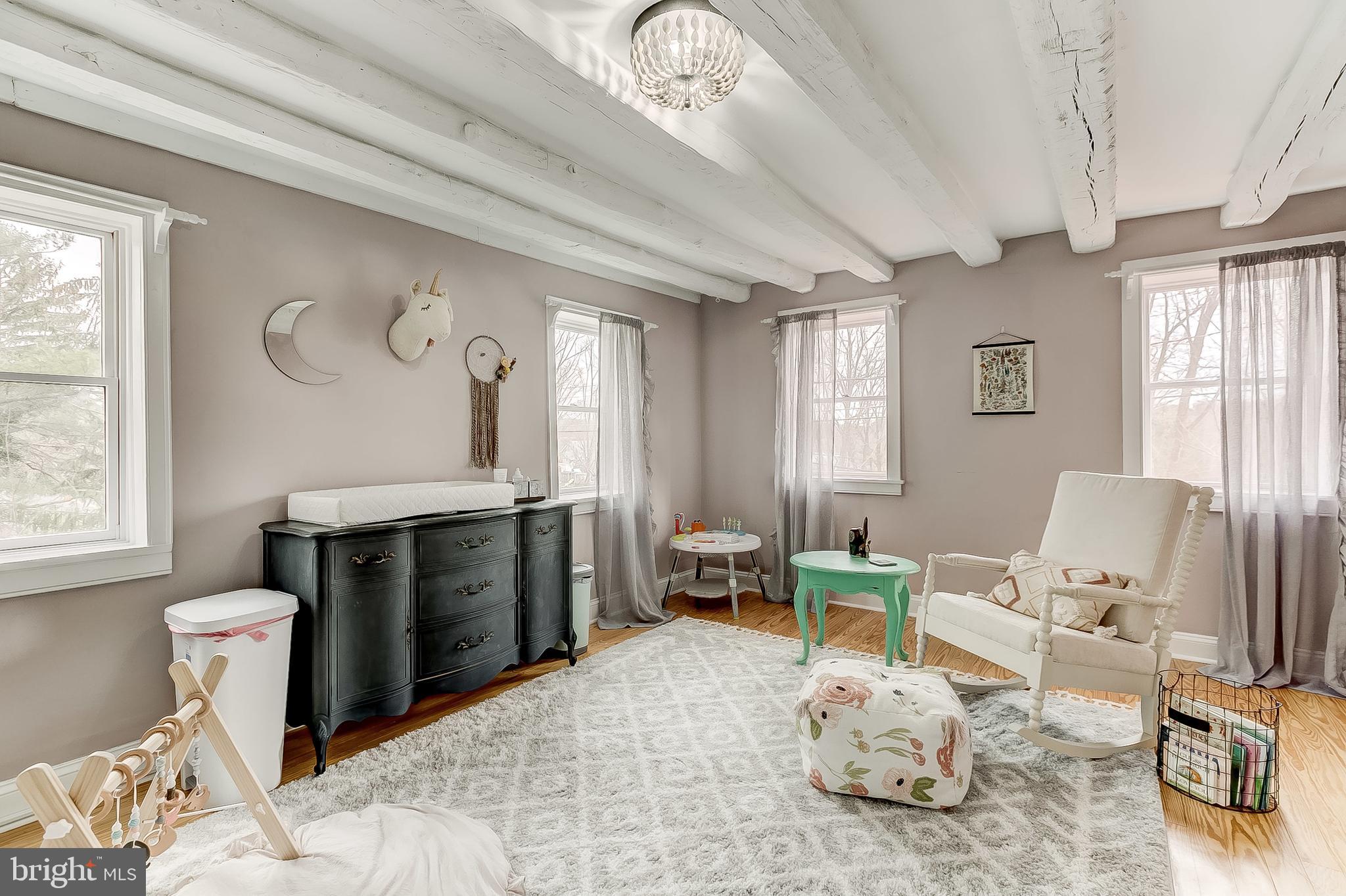 2812 Cape Horn Road Westminster, MD 21157 - Photo 30 of 40 a living room with furniture a fireplace and a flat screen tv