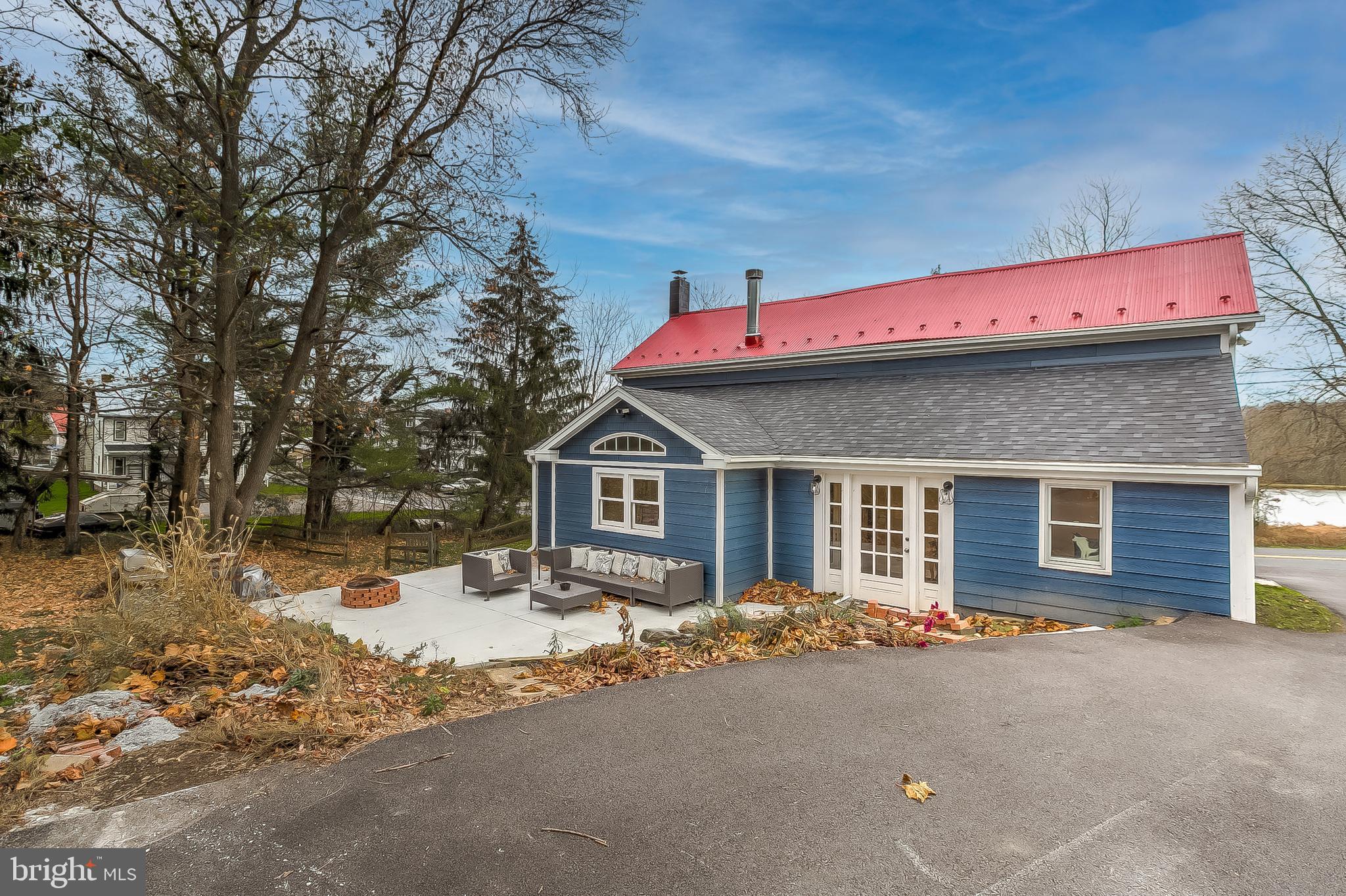 2812 Cape Horn Road Westminster, MD 21157 - Photo 36 of 40 a front view of a house with a yard and garage