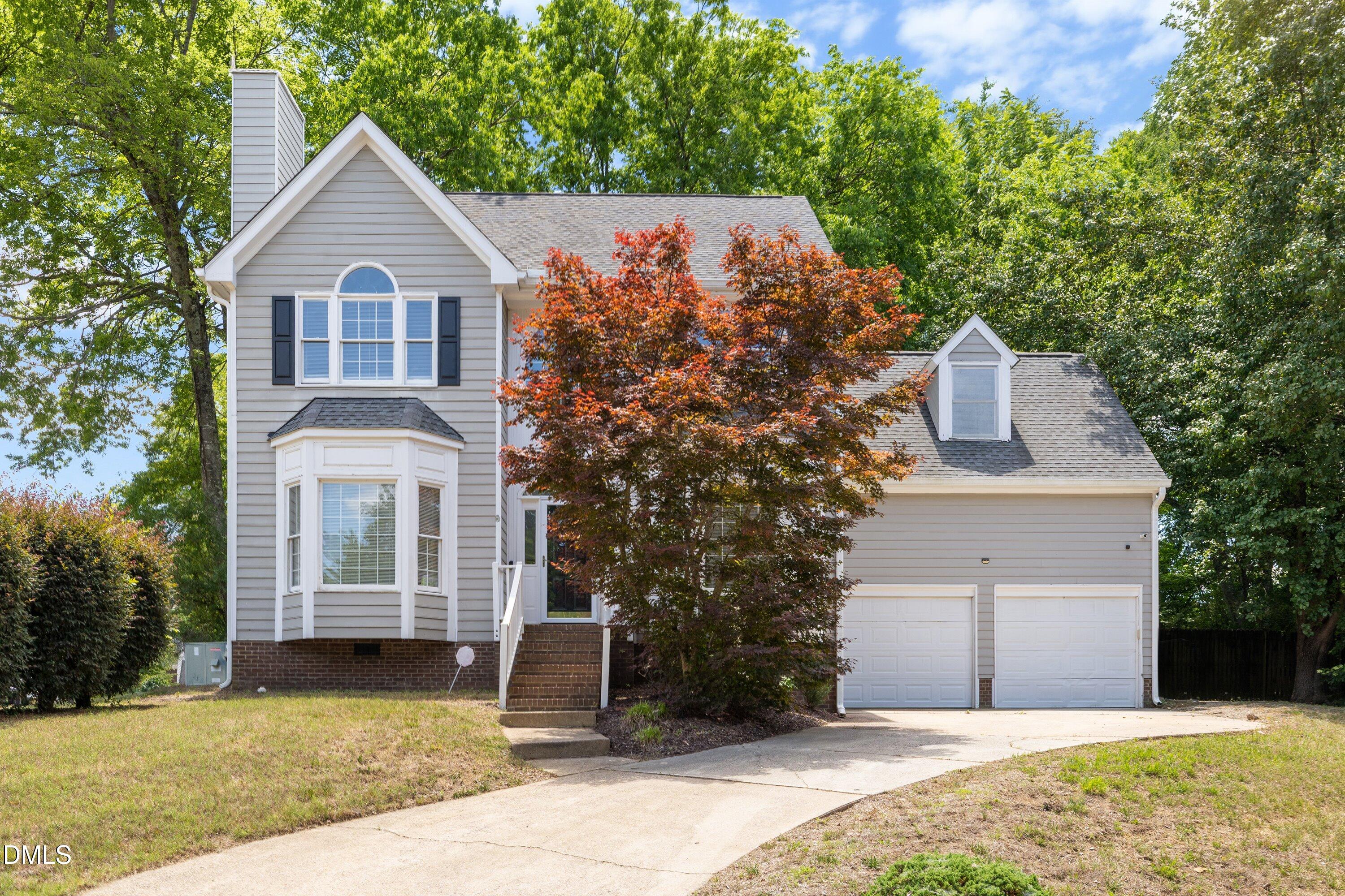 2517 Birchford Court Raleigh, NC 27604 - Photo 1 of 63 a front view of a house with a yard and garage
