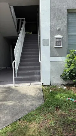 a view of backyard with staircase