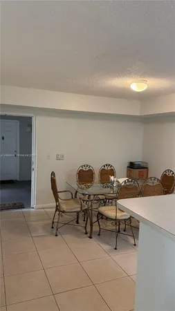 a work room with furniture and a rug