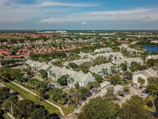 an aerial view of residential building and ocean