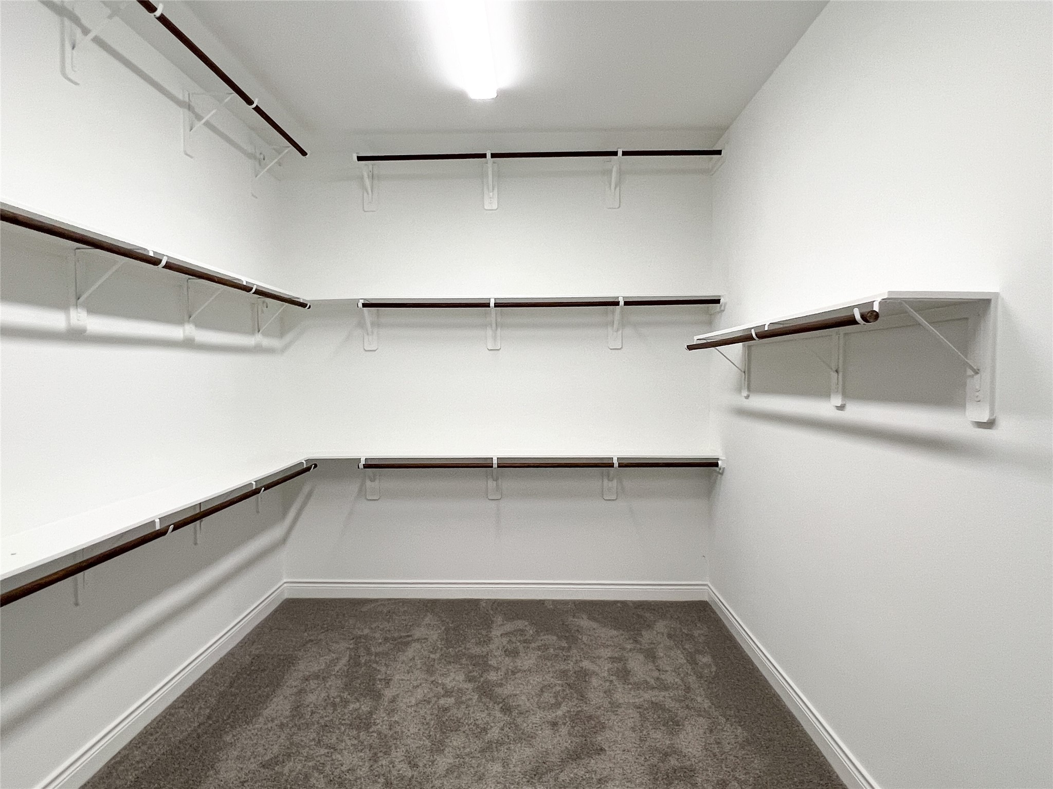 126 Lakeland Circle Rosharon, TX 77583 - Photo 28 of 49 a view of an empty walk in closet