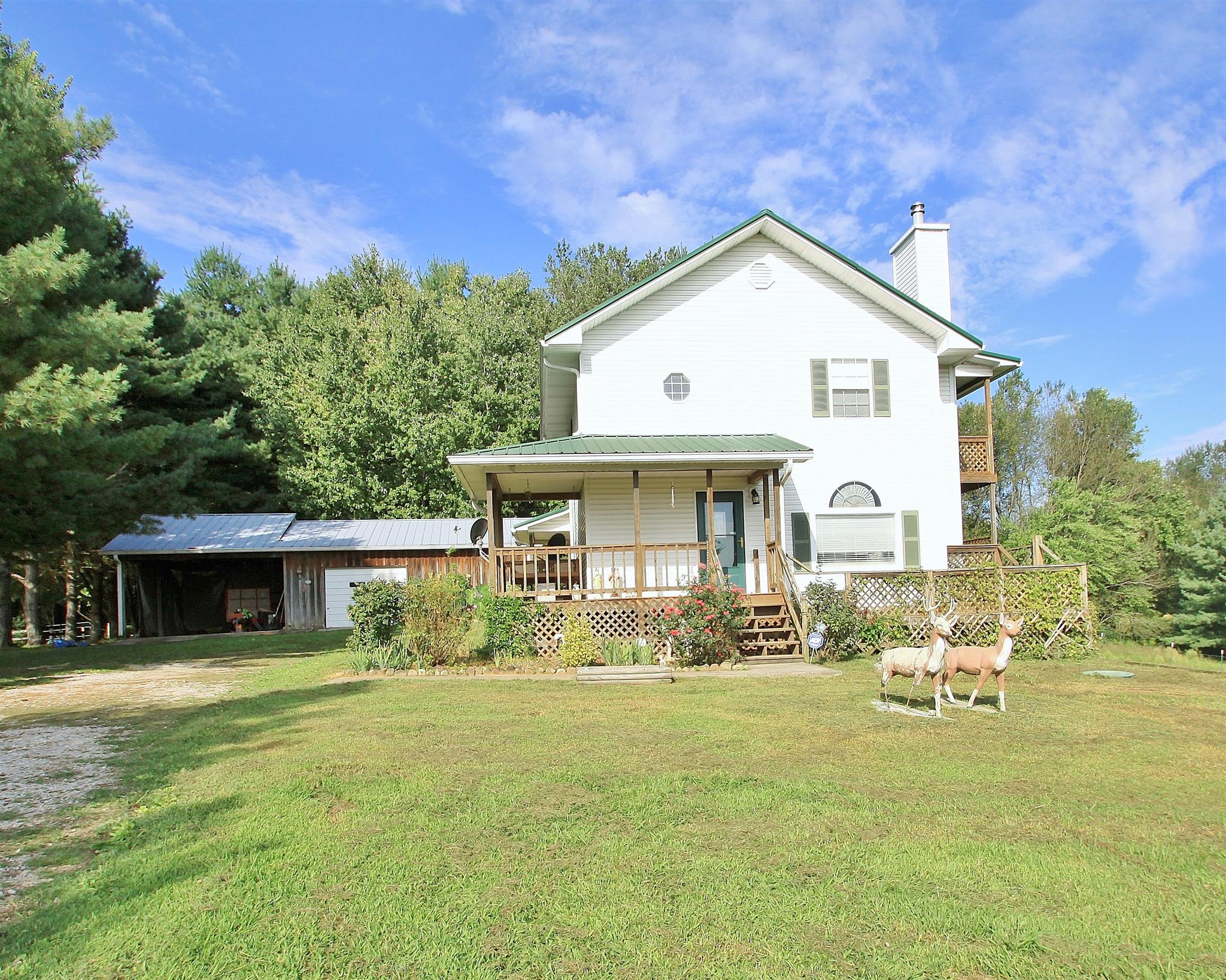 922 Harpo Road Manchester, TN 37355 - Photo 1 of 17 a front view of a house with garden